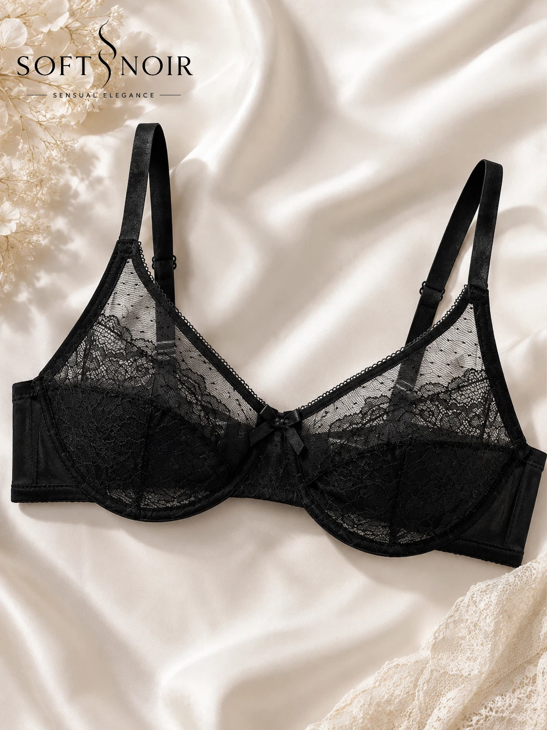 Black floral lace underwire bra styled on ivory satin fabric