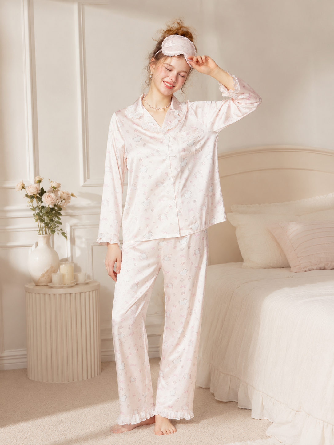 Model wearing Soft Noir blush ivory bunny print satin pajama set with sleep mask