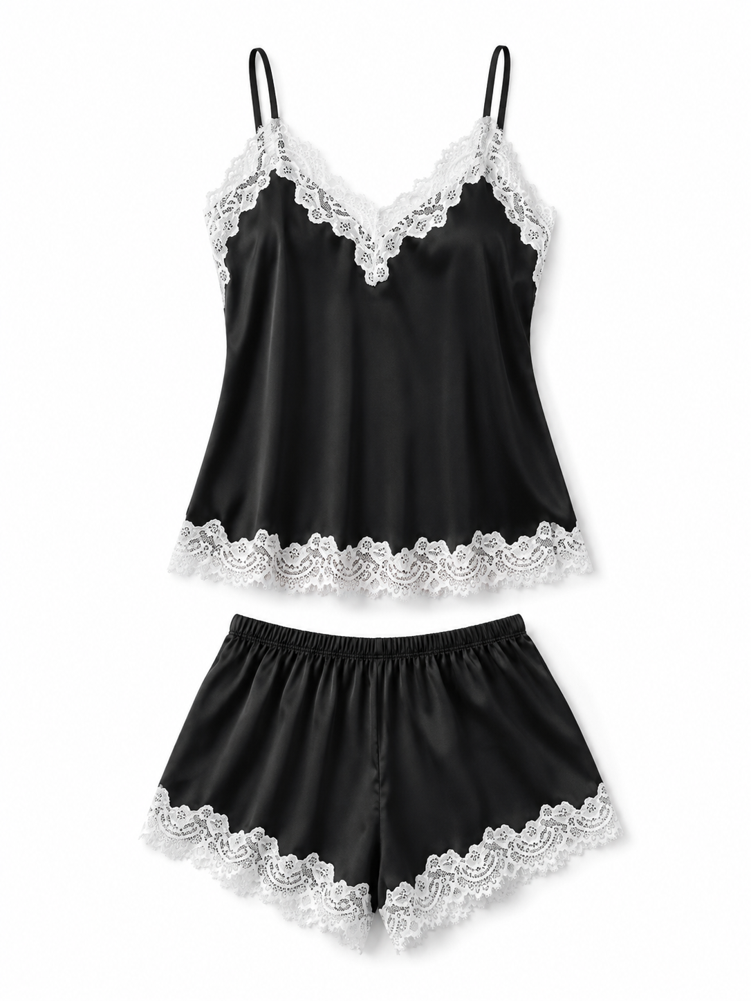 Black satin camisole and shorts pajama set with white lace trim on white background