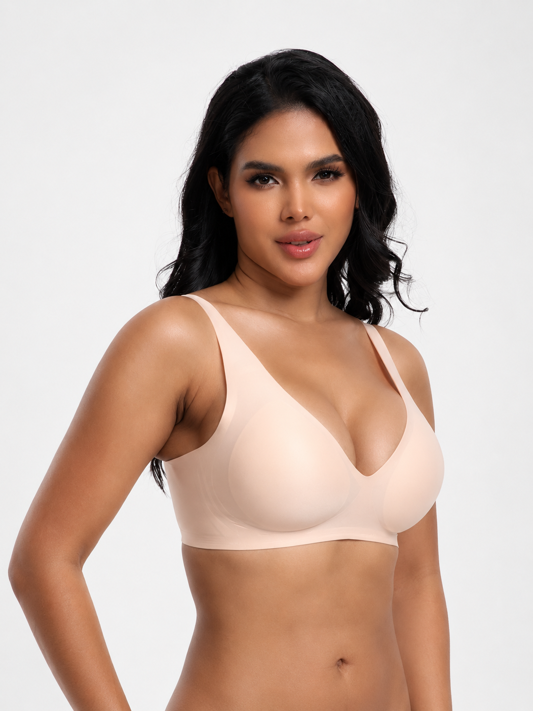 Model wearing Soft Noir nude beige wireless seamless V-neck bra