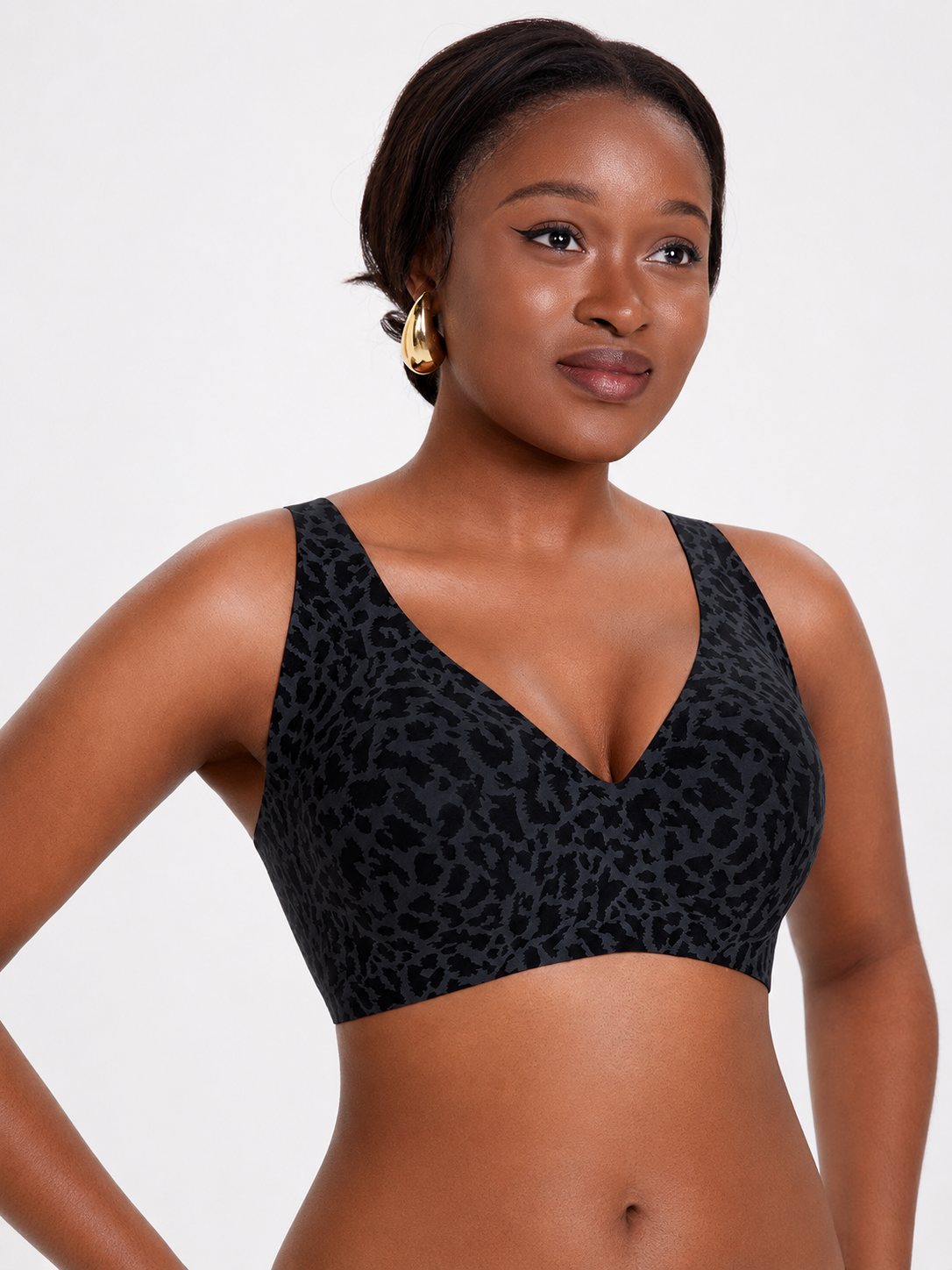 Model wearing Soft Noir taupe gray wireless V-neck bralette