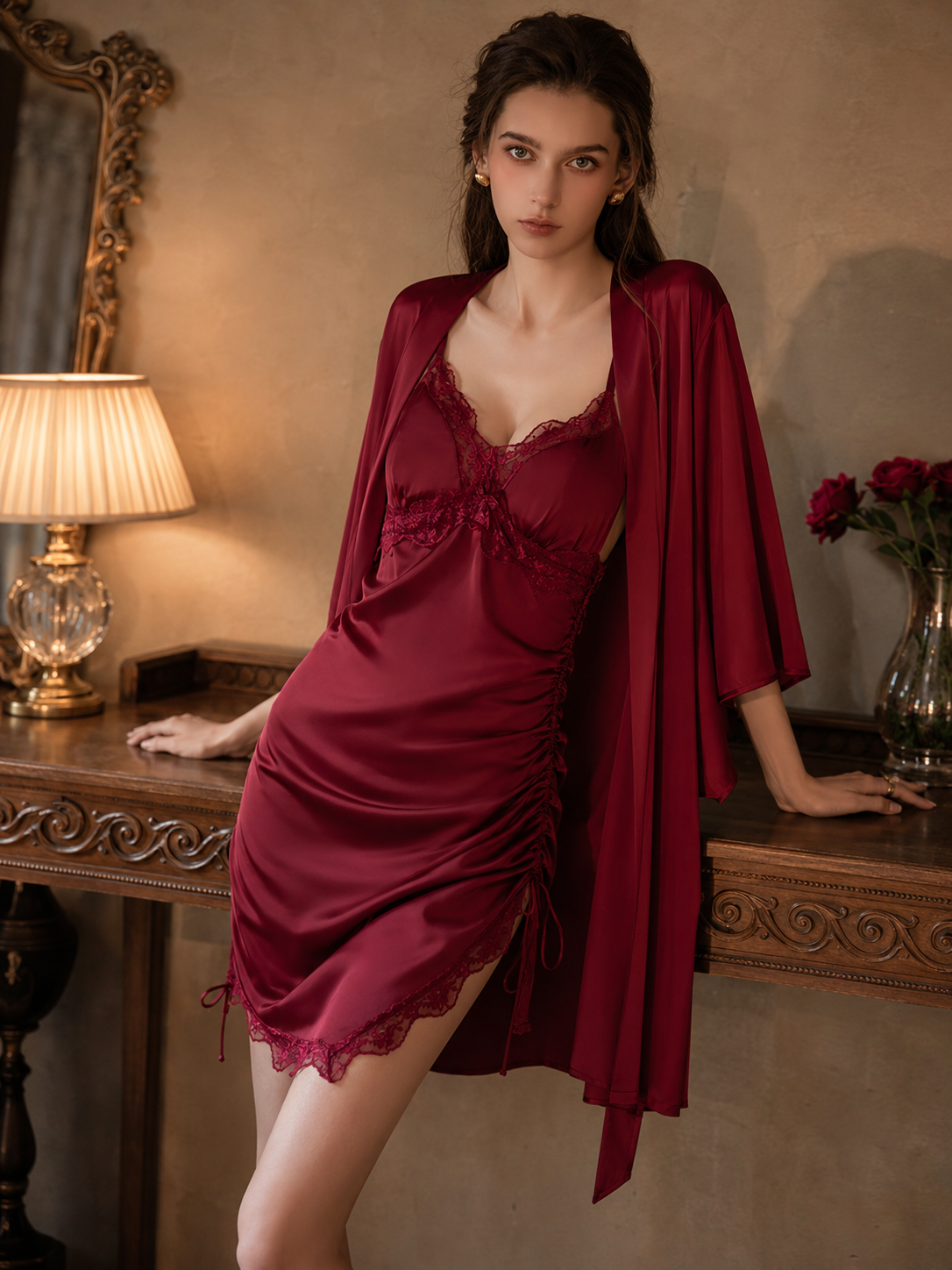 Model wearing Soft Noir wine red ruched satin chemise with matching robe