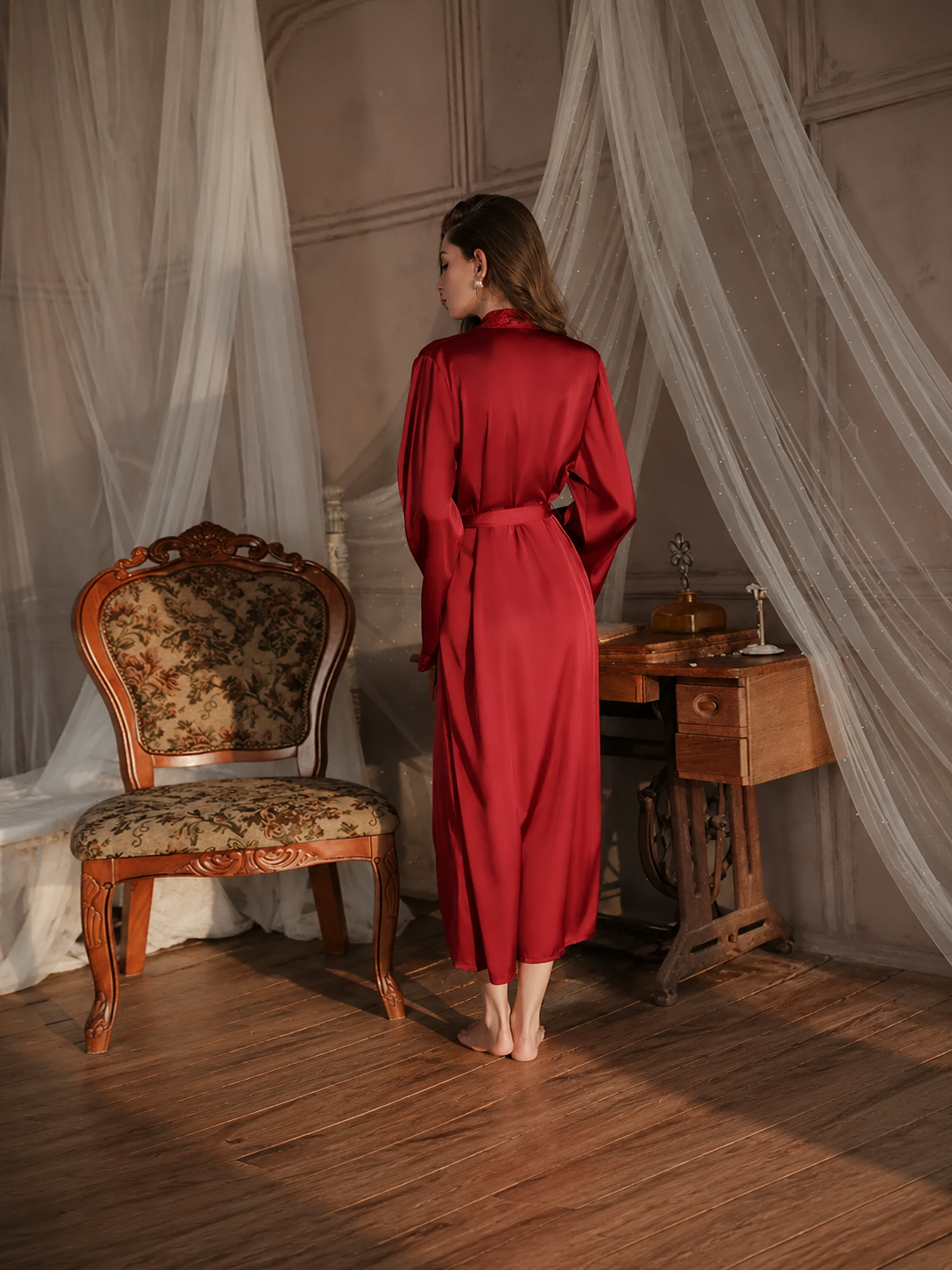 Model wearing Soft Noir wine red satin long robe back view